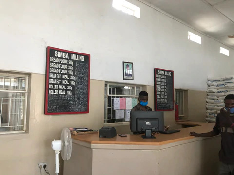 Zambian store with price board.