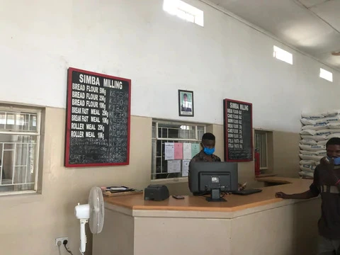Zambian store with price board.